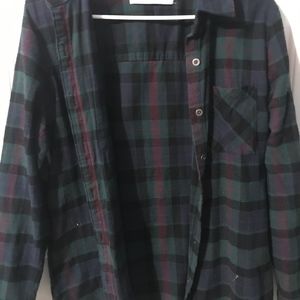 blue and green flannel with design on back